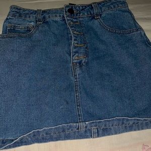 Denim skirt w/ rainbow print on pockets.